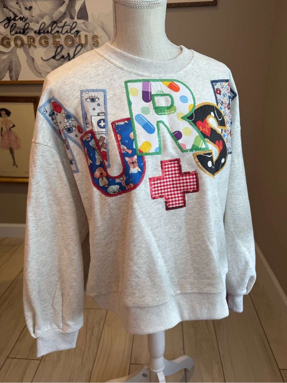 NWOT! QUEEN OF SPARKLES Light Gray Nurse Patchwork Fabric Sweatshirt